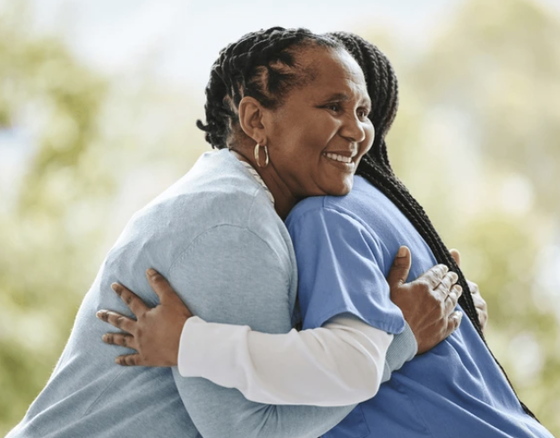 Elderly woman bonding with caregiver